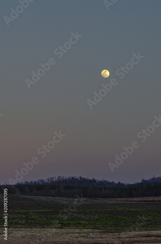 Pre-dawn moon over Cheaha Mountain near Munford  Alabama  USA