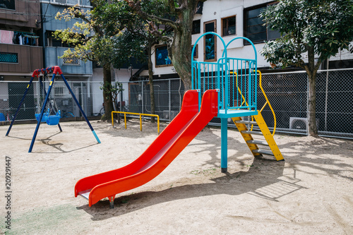 Slide and swings on playground in Osaka, Japan