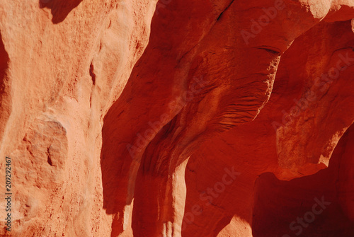 Cave with red sandstone formation photo