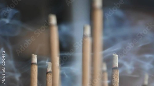 slow motion close up of incense smoke at kinkakuji temple in kyoto, japan- originally recorded at 180p photo