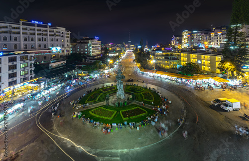 Da Lat, Vietnam - May 12th, 2017: Da Lat Market night skyline night view with lights attracts thousands of people walking along the road shopping crowded bustle of city tourism in Da Lat, Vietnam