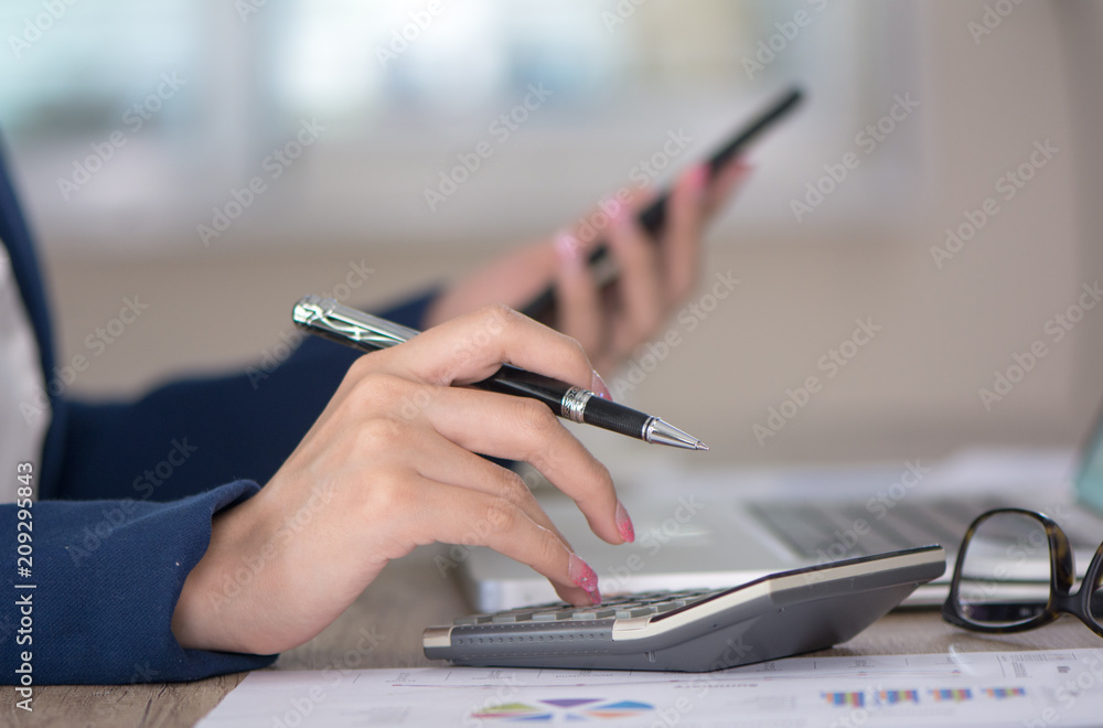 Fototapeta premium Photo young woman business working calculating Finance