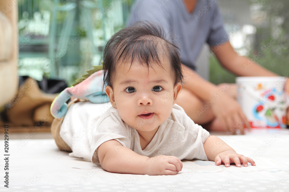 Bright eyes and innocent of asian little child on the bed in bedroom at home Bright eyes and innocent of asian little child on the bed in bedroom at home