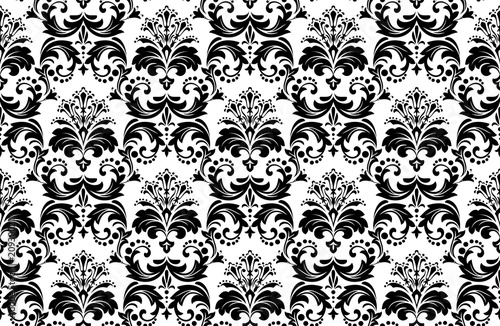 Wallpaper in the style of Baroque. A seamless vector background. White and black floral ornament. Graphic pattern for fabric, wallpaper, packaging. Ornate Damask flower ornament