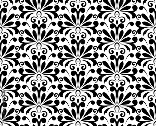 Wallpaper in the style of Baroque. A seamless vector background. White and black floral ornament. Graphic pattern for fabric, wallpaper, packaging. Ornate Damask flower ornament
