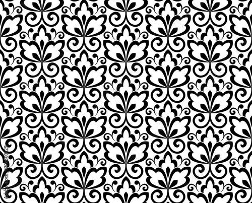 Wallpaper in the style of Baroque. A seamless vector background. White and black floral ornament. Graphic pattern for fabric, wallpaper, packaging. Ornate Damask flower ornament