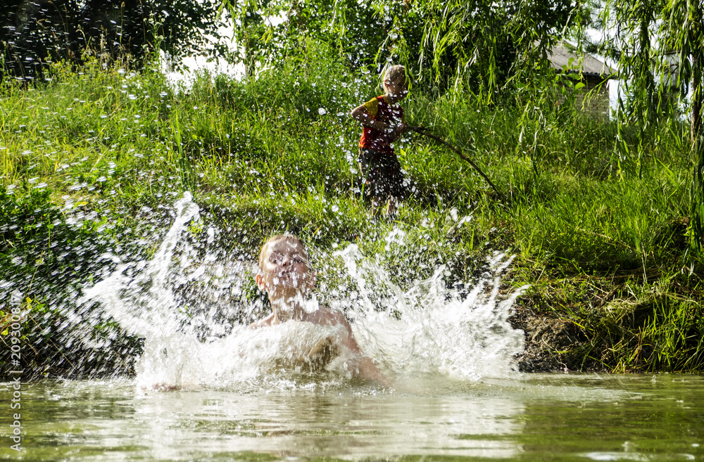 boy jumping into the water . boy jumping into the water .