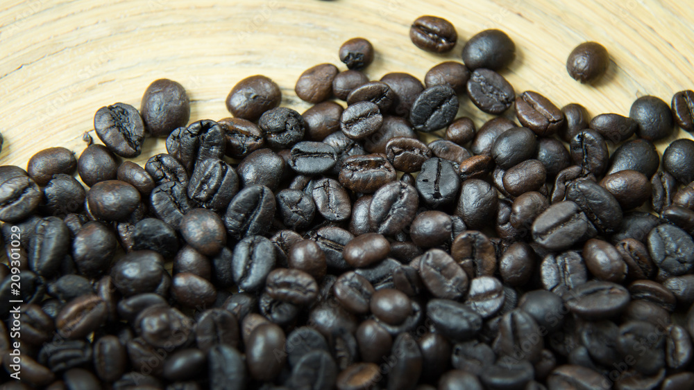 The coffee roasted on wood close up image for background. The coffee roasted on wood close up image for background.