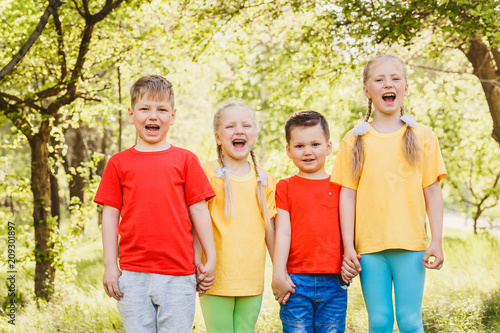 happy fun kids in colorful t-shirts outdoors
