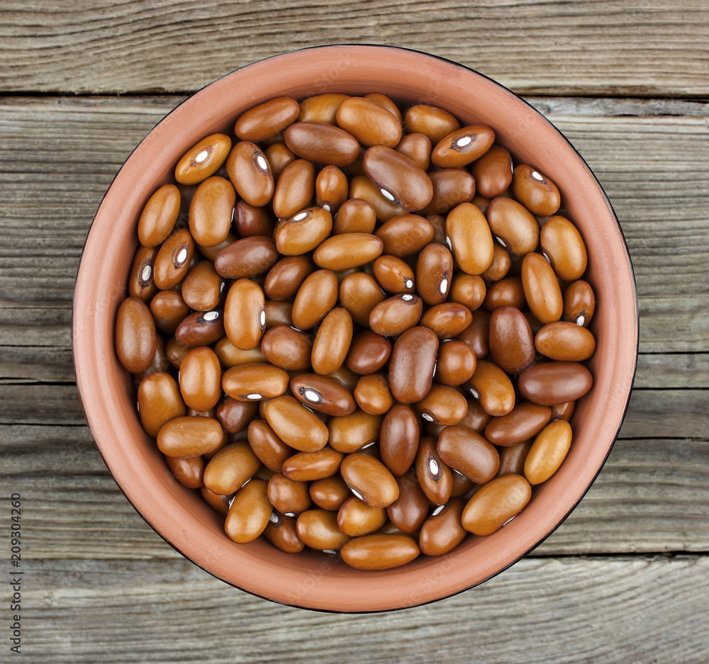 Haricot beans in bowl on wooden background Haricot beans in bowl on wooden background
