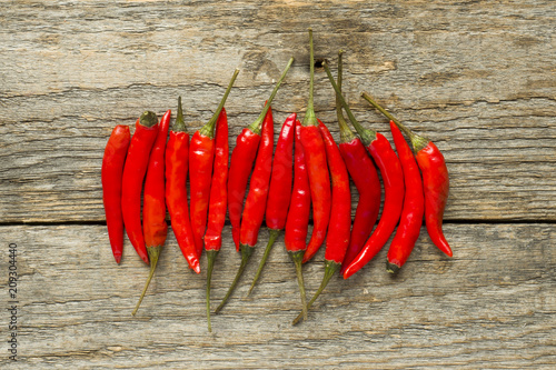 Chili hot red on a wooden rustic background