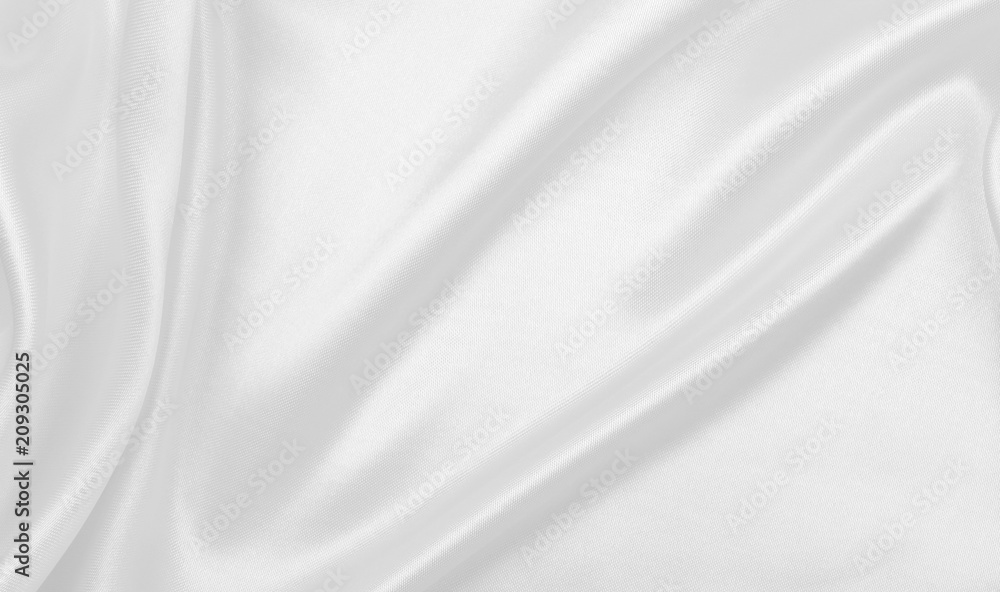 Smooth elegant white silk or satin luxury cloth texture as wedding background. Luxurious background design