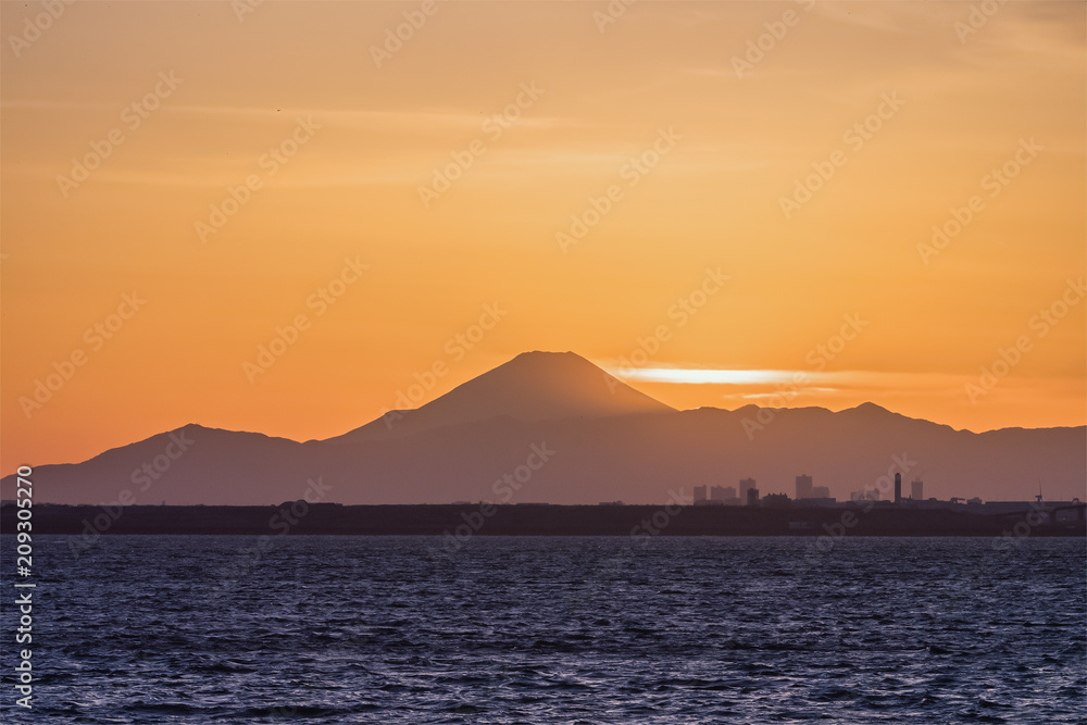 Mountain Fuji and Tokyo bay at sunset time in winter season.Tokyo Bay is a bay located in the southern Kanto region of Japan, and spans the coasts of Tokyo, Kanagawa Prefecture, and Chiba Prefecture. Mountain Fuji and Tokyo bay at sunset time in winter season.Tokyo Bay is a bay located in the southern Kanto region of Japan, and spans the coasts of Tokyo, Kanagawa Prefecture, and Chiba Prefecture.