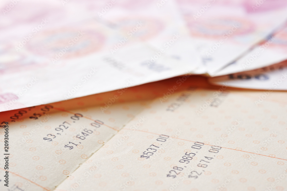 Close up saving account passbook and renminbi Close up saving account passbook and renminbi