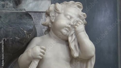A marble statue of a crying angel in a Church, York, United Kingdom