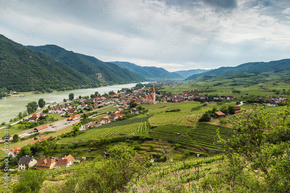 Scenic View into the Wachau with the river Danube and town Weissenkirchen in Lower Austria.