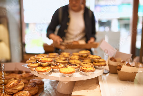 Handsome asian man choosing bakery in store