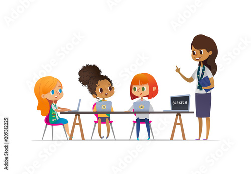 Happy girl scouts sitting at laptops and learning programming during lesson, smiling female troop leader standing near them. Concept of coding for children in scouting camp. Vector illustration.