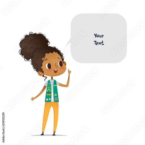 Young smiling African American girl scout dressed in uniform with badges and patches and speech bubble with place for text isolated on white background. Female scouter, member of troop, speaker.