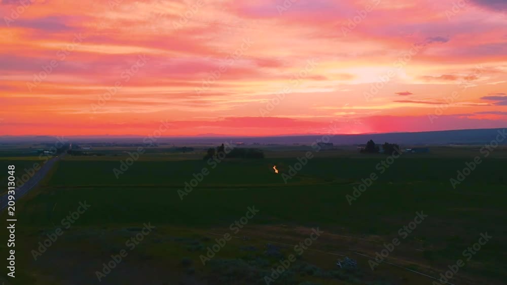 Slow downward shot of a sunset over farmland in Southeast Idaho. Slow downward shot of a sunset over farmland in Southeast Idaho.
