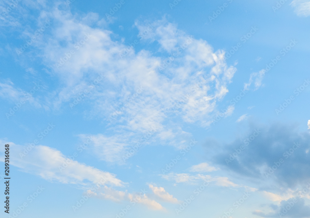 background of fluffy clouds moving over blue sky in a sunny day with copy space. background of fluffy clouds moving over blue sky in a sunny day with copy space.