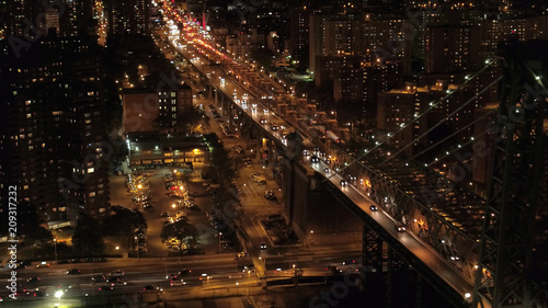 AERIAL: Dense traffic on Williamsburg Bridge highway leading to Manhattan, NYC