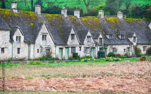 Cotswold stone cottages in Bibury, England photo