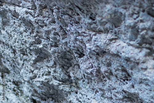 texture of a stone friable wall close-up, selective focus