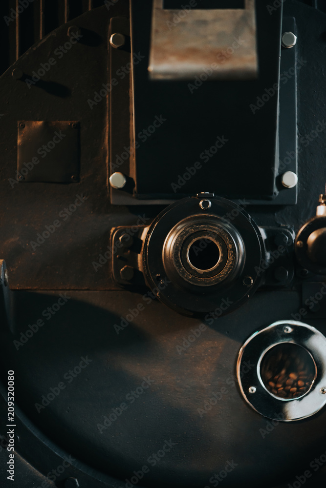 Hot coffee beans in traditional coffee roaster