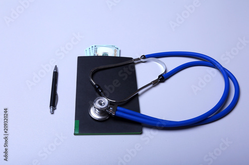 Medical stethoscope and banknote with healthcare concept