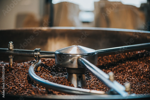 Konstfotografi Traditional coffee roaster with coffee beans in cylinder