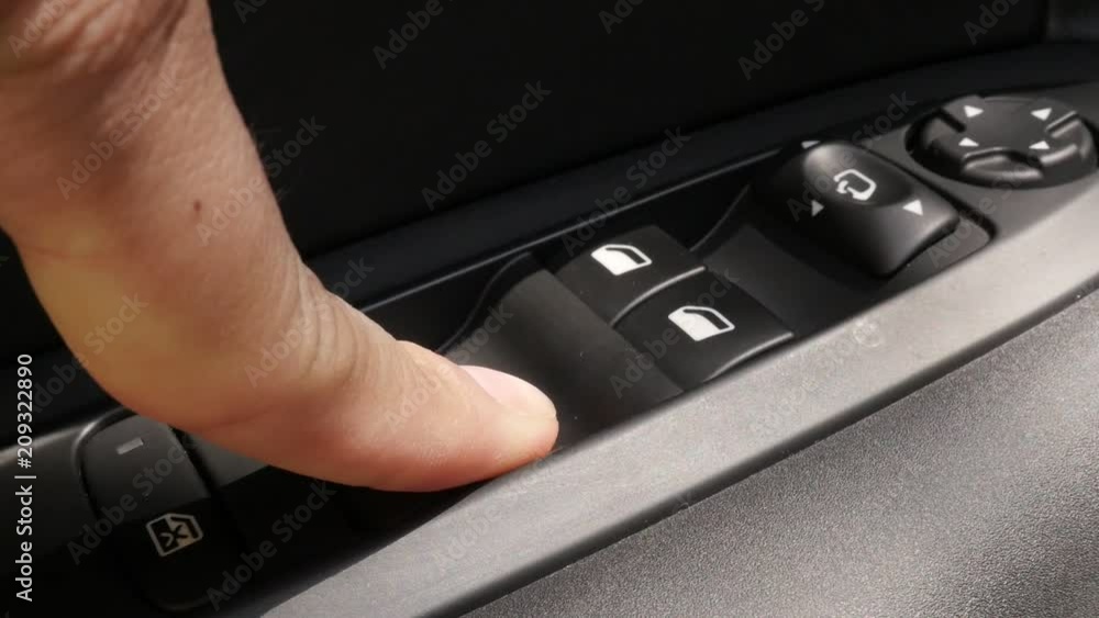 Slow motion car window button pressing video Slow motion car window button pressing video