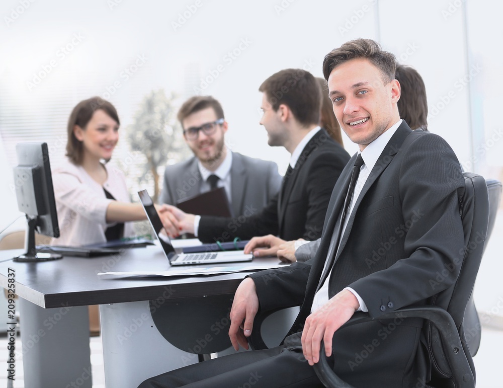 business team with a senior Manager in the foreground business team with a senior Manager in the foreground