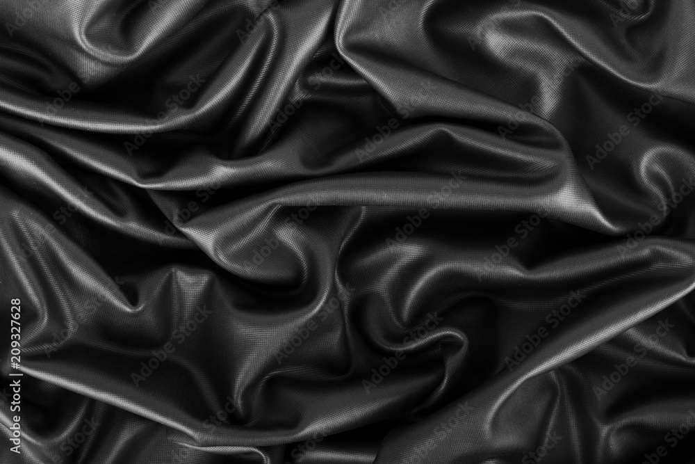 Closeup of rippled black silk fabric