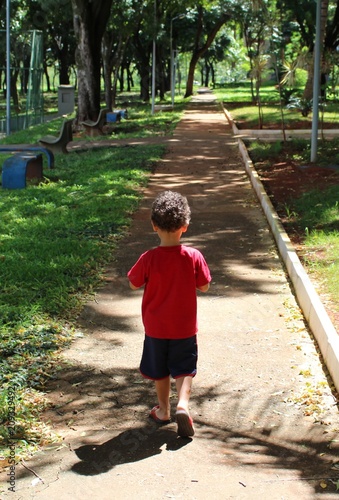 little child walking in the park