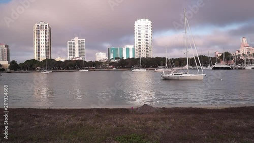 Vinoy Boat Basin sunrise looking west. Boats and building illuminated by the rising sun. Downtown St Petersburg Florida. photo