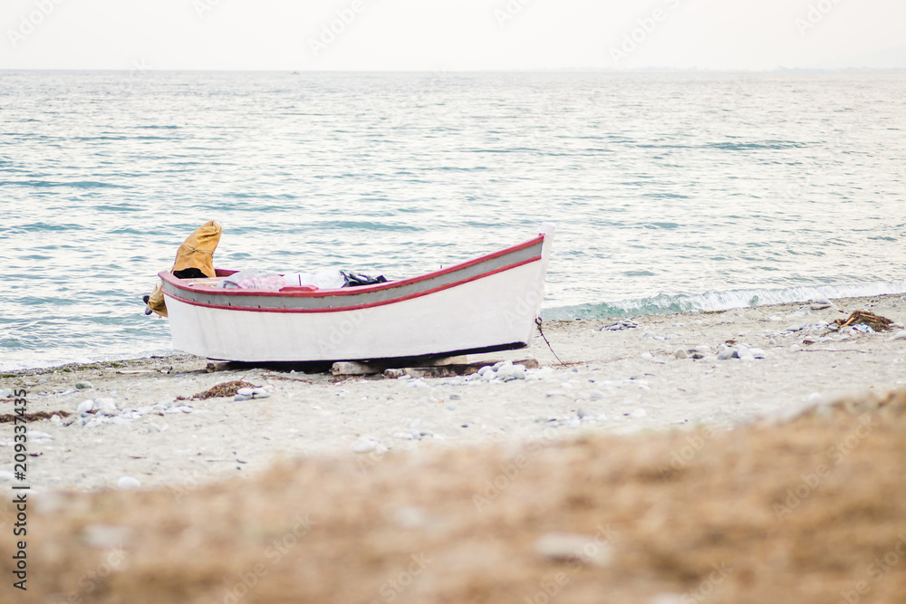 Leptokarya, Greece - June 09, 2018: Drawn boats on the coast Leptokarya, Greece - June 09, 2018: Drawn boats on the coast