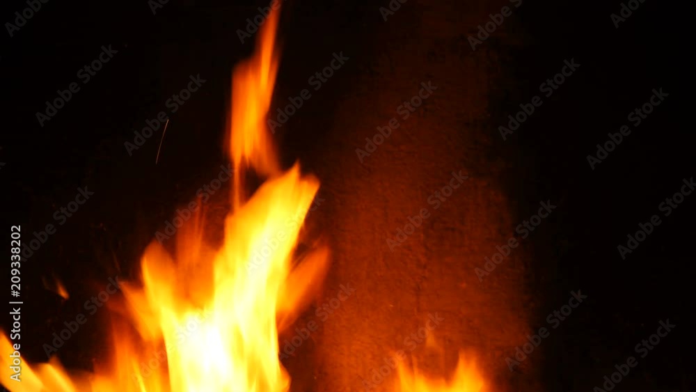 Slow motion of Fireplace burning. Warm cozy burning fire in a brick fireplace close up. Cozy background. Bright burning wood, campfire ... Slow motion of Fireplace burning. Warm cozy burning fire in a brick fireplace close up. Cozy background. Bright burning wood, campfire ...