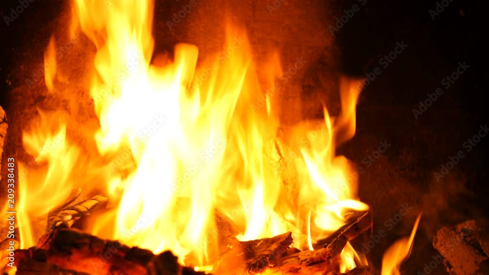 Slow motion of Fireplace burning. Warm cozy burning fire in a brick fireplace close up. Cozy background. Bright burning wood, campfire ... Slow motion of Fireplace burning. Warm cozy burning fire in a brick fireplace close up. Cozy background. Bright burning wood, campfire ...