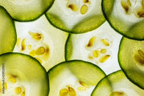 slices of zucchini on a white background