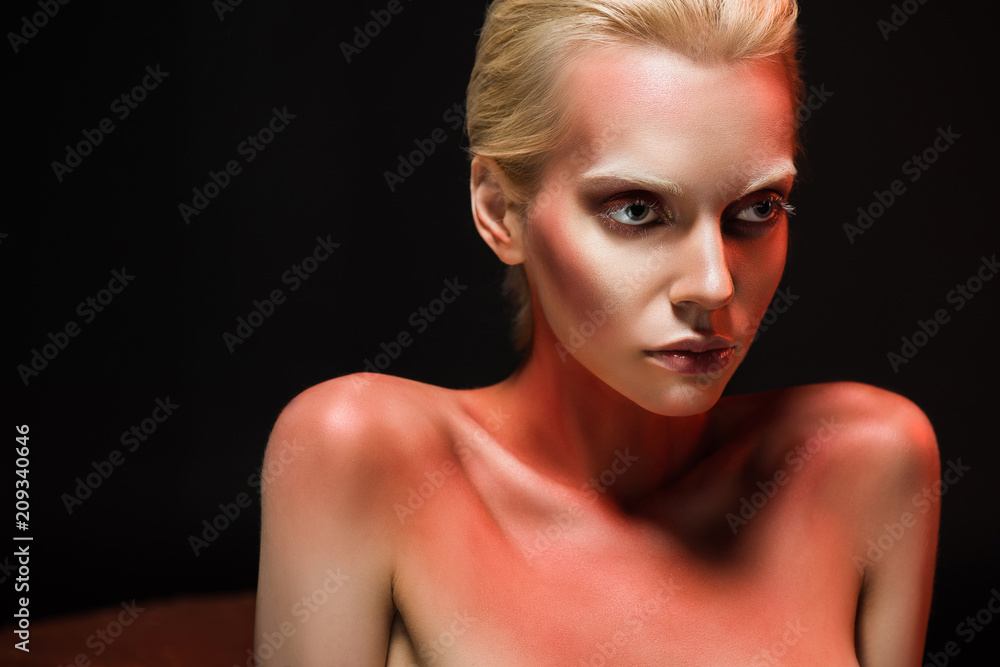 attractive woman with red makeup for fashion shoot, isolated on black attractive woman with red makeup for fashion shoot, isolated on black