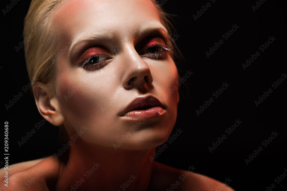 attractive young woman with stylish makeup, isolated on black attractive young woman with stylish makeup, isolated on black