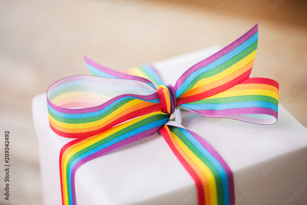 homosexual and lgbt concept - close up of gift box with gay pride awareness  ribbon Photos | Adobe Stock