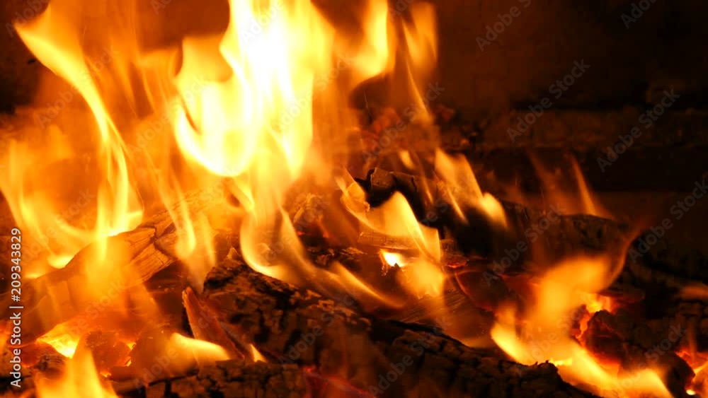 Slow motion of Fireplace burning. Warm cozy burning fire in a brick fireplace close up. Cozy background. Bright burning wood, campfire ... Slow motion of Fireplace burning. Warm cozy burning fire in a brick fireplace close up. Cozy background. Bright burning wood, campfire ...
