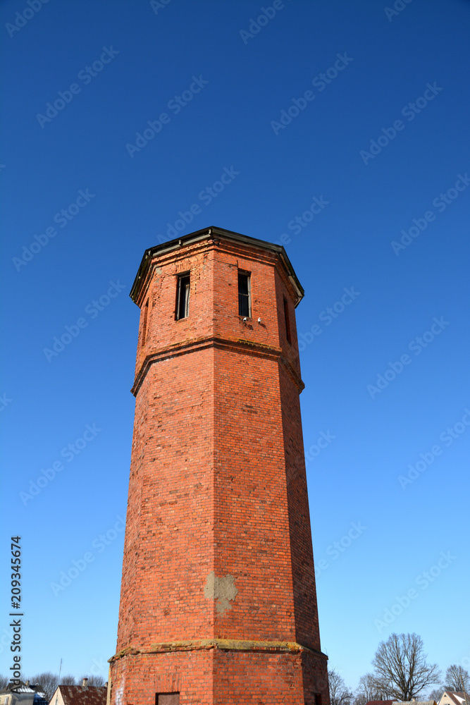 old abandoned red bricks train station tower