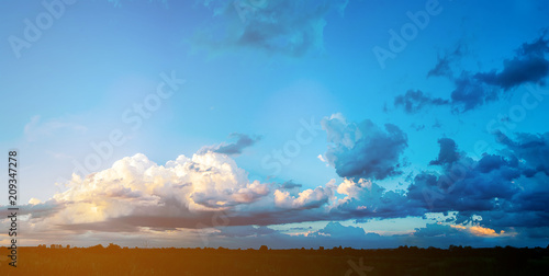 Massive clouds on evening sky with sun beams © rostyslav84