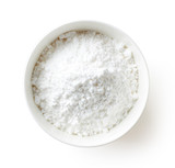 Bowl of powder sugar on white background, from above