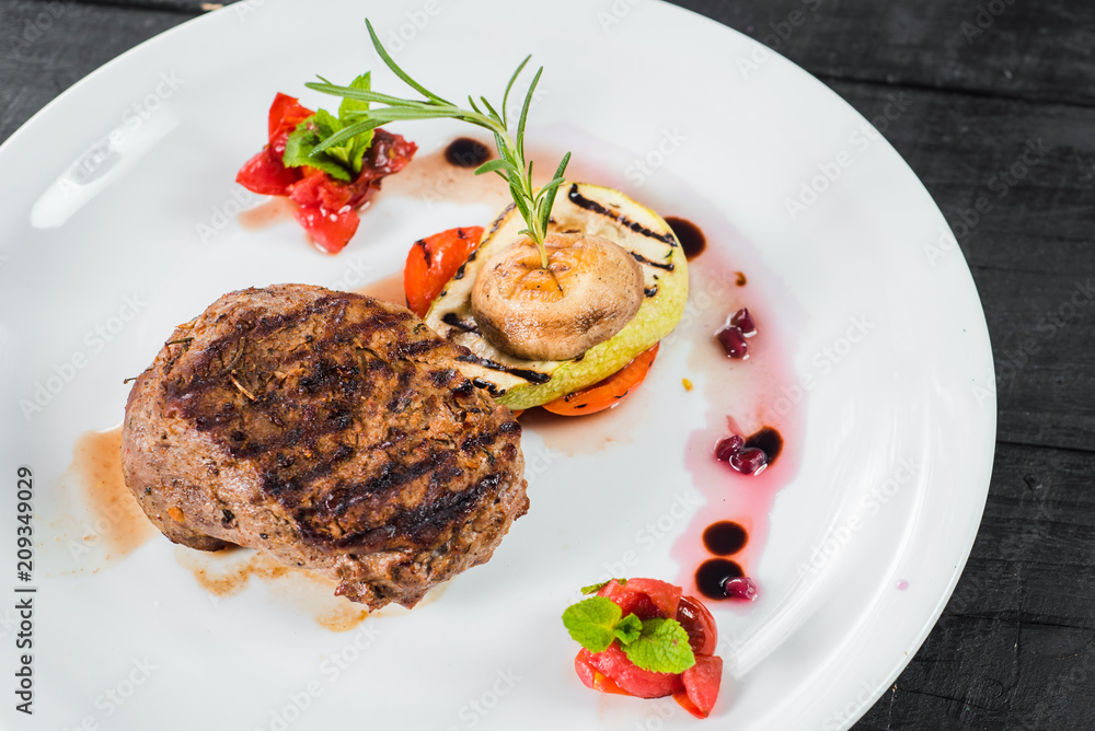 Grilled meat steak dish with fruits garnish