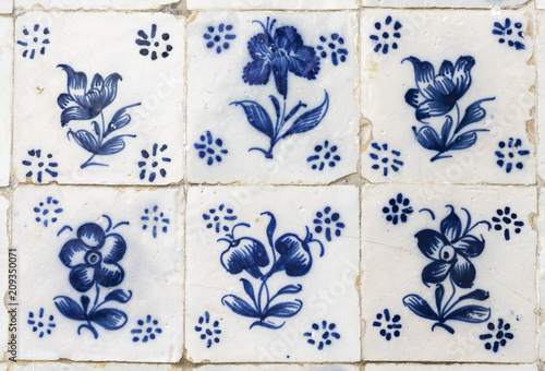 Ornamental old typical tiles from Portugal called azulejos made with colored ceramic tiles