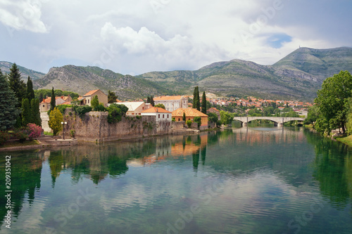 Picturesque landscape with mountains and  ancient city on the banks of the river.  Bosnia and Herzegovina  view of Trebisnjica river  and Old Town of Trebinje